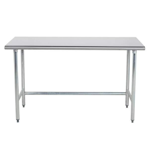 An Advance Tabco stainless steel work table with an open base and metal legs.