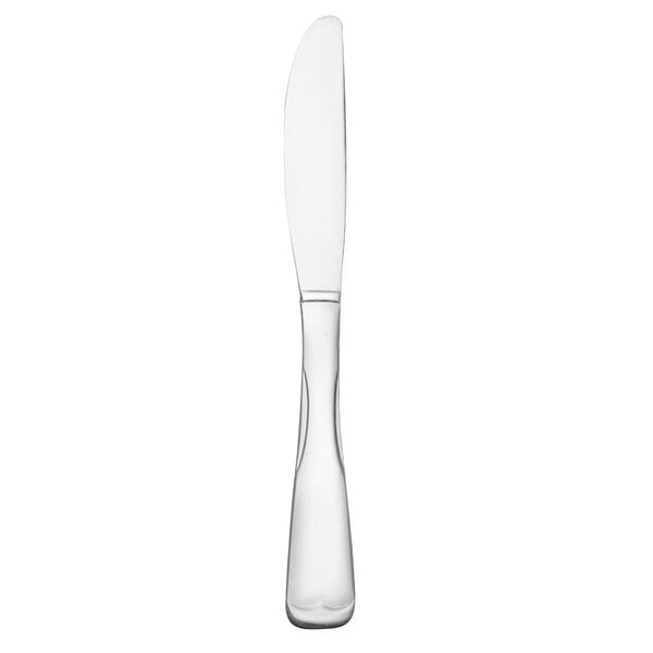 A Libbey stainless steel dinner knife with a white handle.