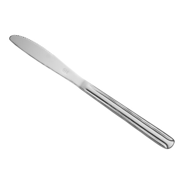 A Libbey stainless steel dinner knife with a silver handle.