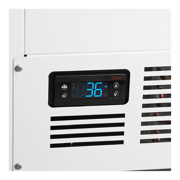 A white Beverage-Air milk cooler with a digital display.