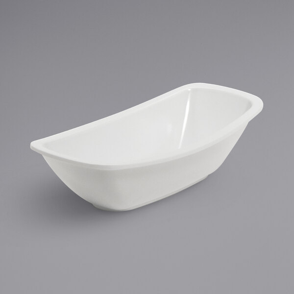 A white bowl on a gray surface.