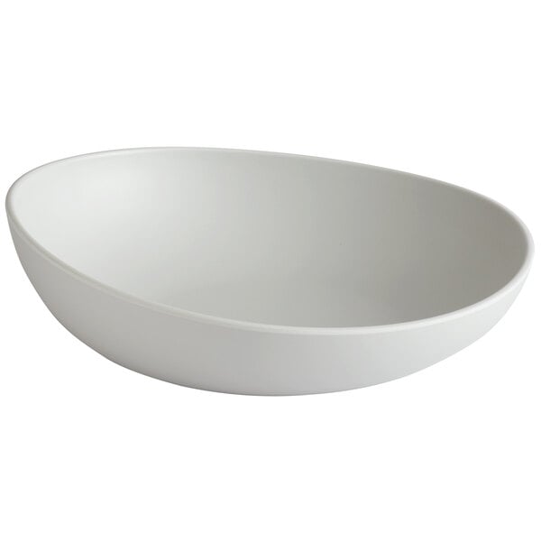 a white bowl with a spoon