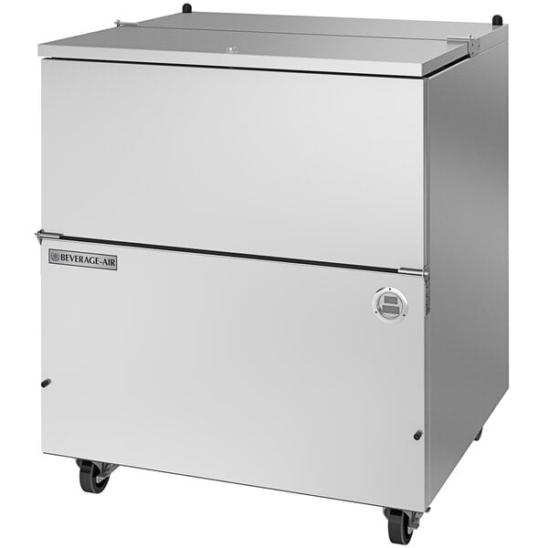 A stainless steel Beverage-Air milk cooler on wheels.