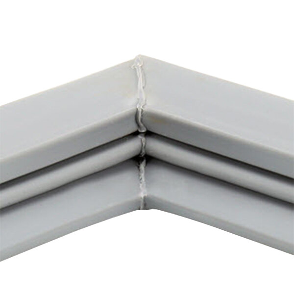 A close up of a gray corner of a metal Beverage-Air door gasket.