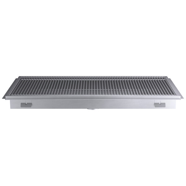 A Regency stainless steel floor trough grate on a metal grate with holes.