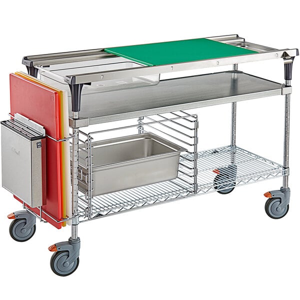 A Metro Prepmate MultiStation with trays and a metal container on wheels.