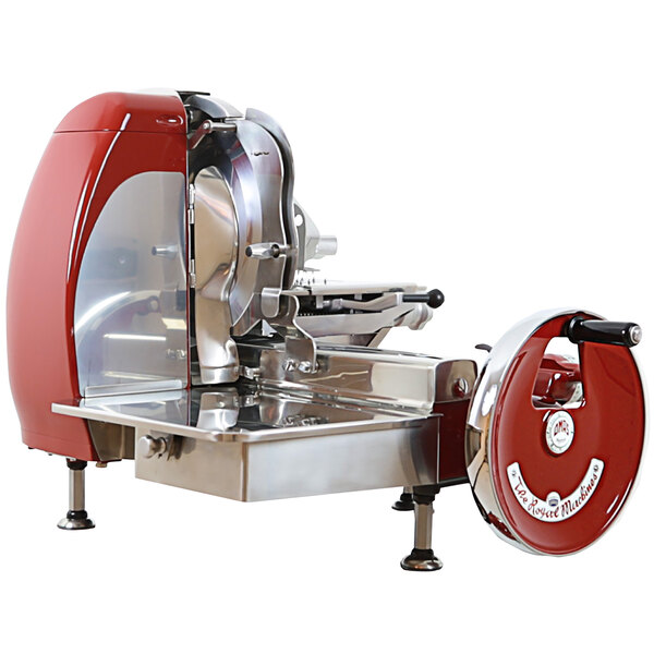 a red and silver meat slicer