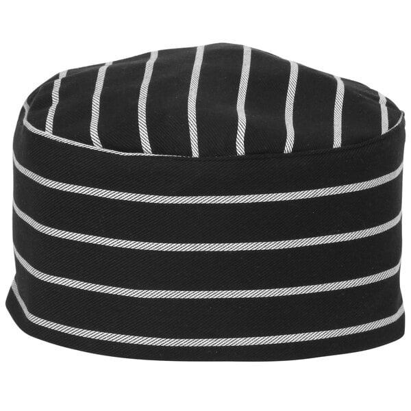 A black and white striped Mercer Culinary baker's skull cap on a counter.