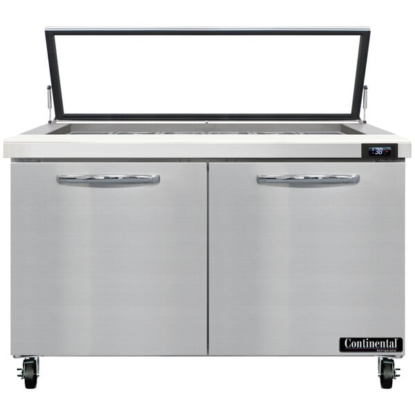 A large stainless steel Continental Refrigerator with hinged glass lids over two doors.