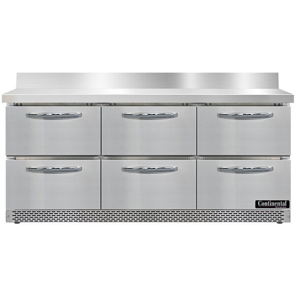 A large stainless steel worktop refrigerator with six drawers.