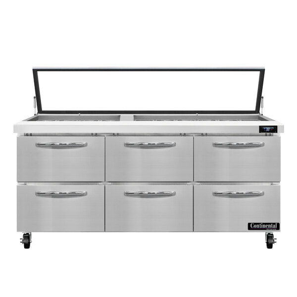 A stainless steel Continental Refrigerator with hinged glass lids over six refrigerated drawers.