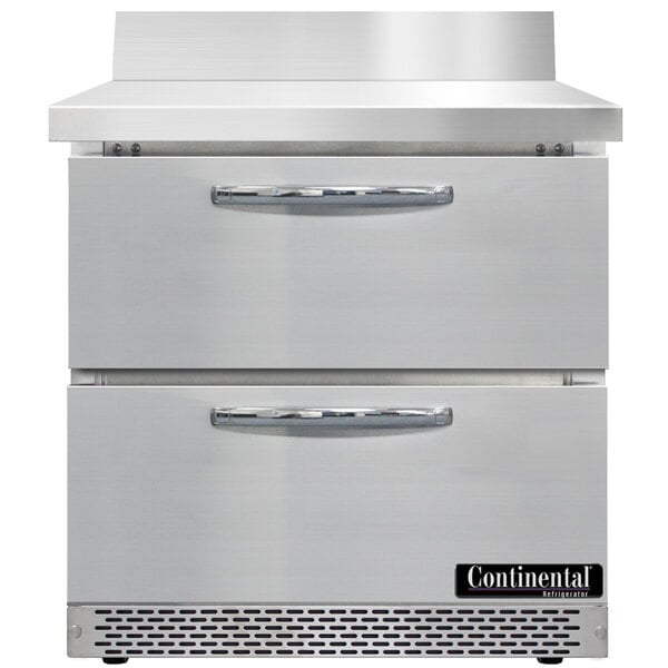 A white worktop refrigerator with two drawers.