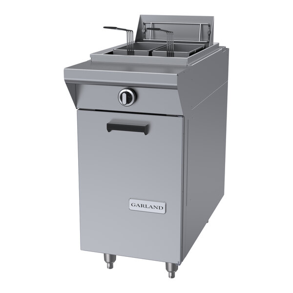 A commercial stainless steel floor fryer with dual baskets and a front control knob.