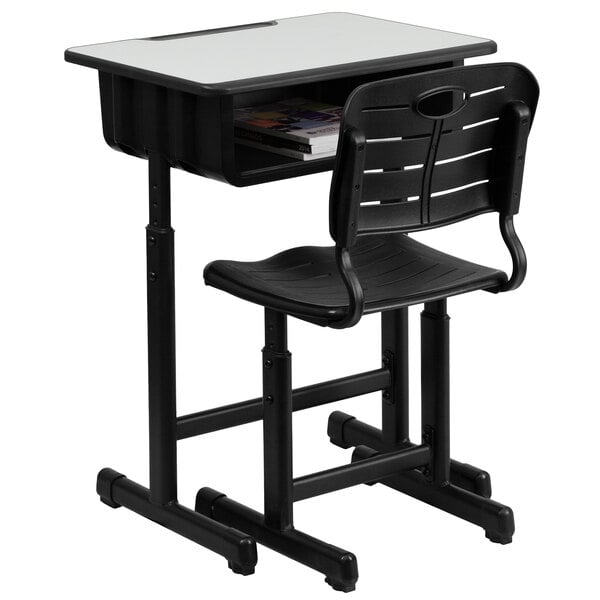 A black school desk with a black chair.