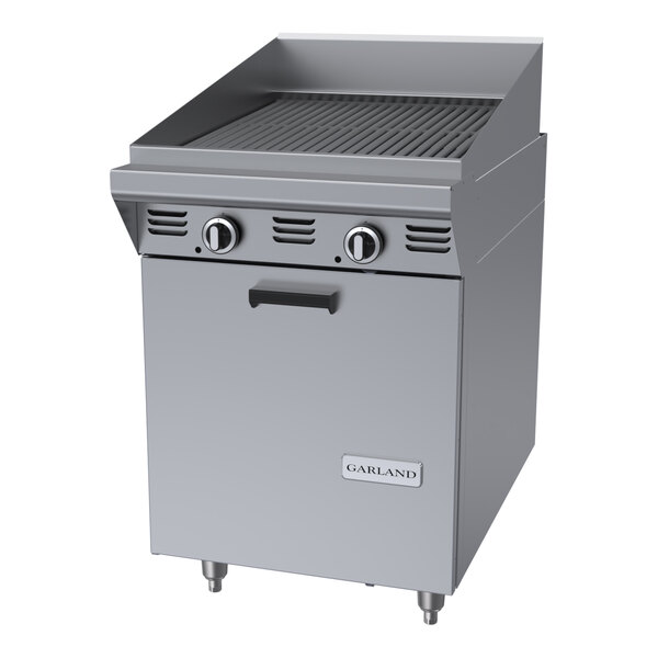 A commercial stainless steel 24-inch briquette charbroiler with storage base and control knobs.
