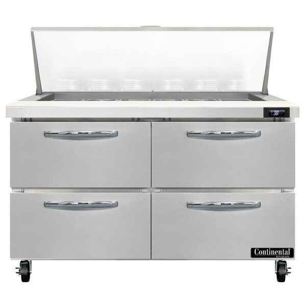A stainless steel Continental Refrigerator with 4 drawers.