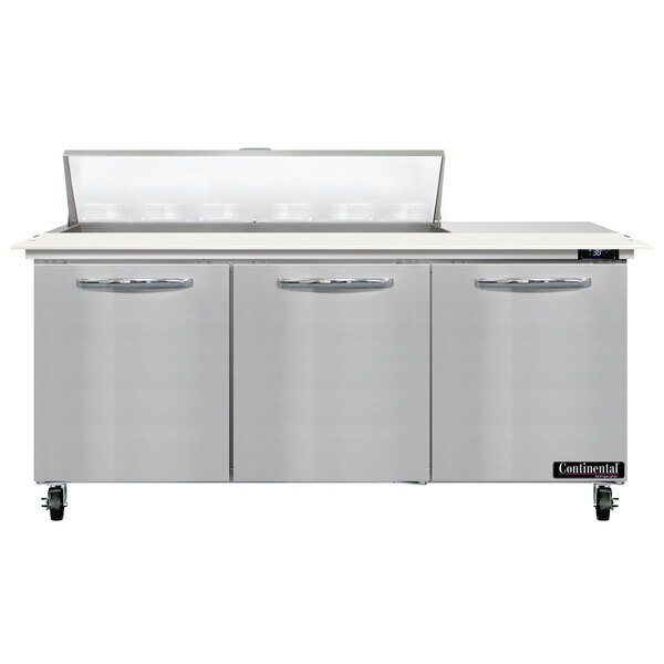 A stainless steel Continental Refrigerator with 3 doors and a cutting top.