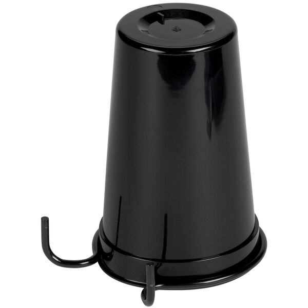 A black plastic container with metal hooks on a table holding straws and cups.