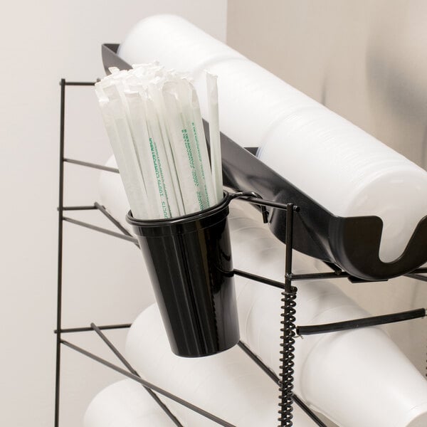 A black metal San Jamar Wireworks cup and straw organizer.