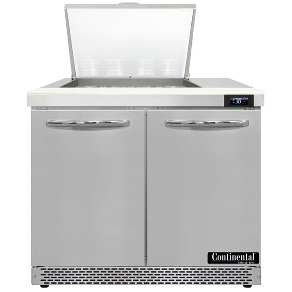 A large stainless steel Continental Refrigerator with two doors open.