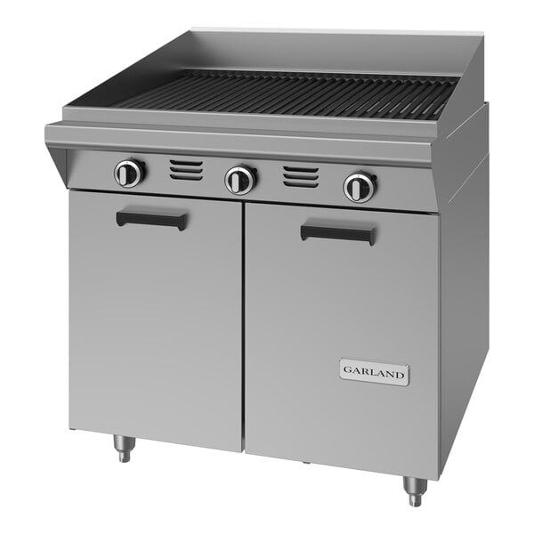 A commercial stainless steel 34-inch briquette charbroiler with three control knobs, a storage base, and piezo ignition.