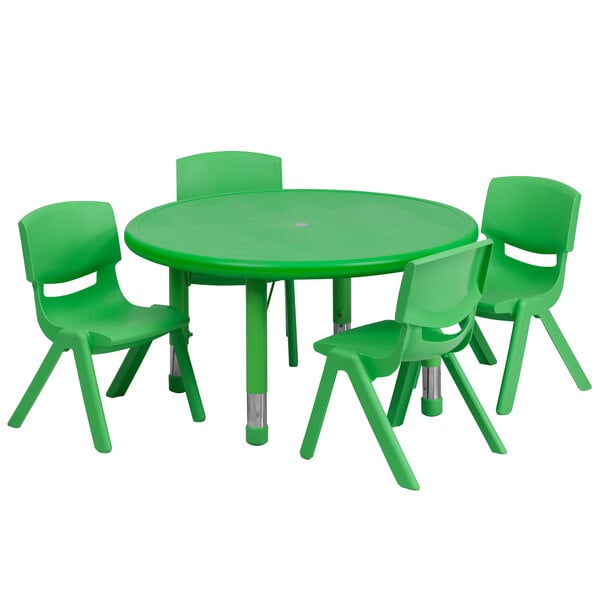 A green plastic table with four green chairs.