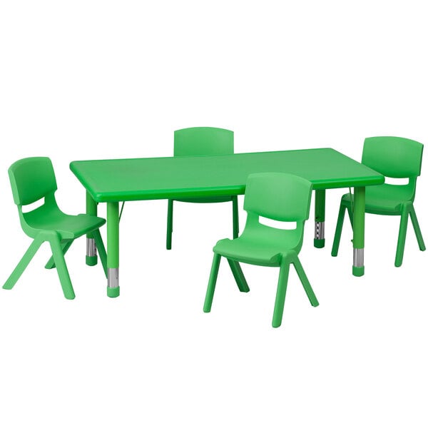 A green plastic rectangular table with legs and four green chairs.