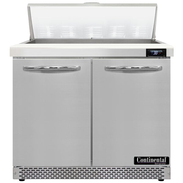 A Continental Refrigerator stainless steel refrigerated prep table with two open doors.
