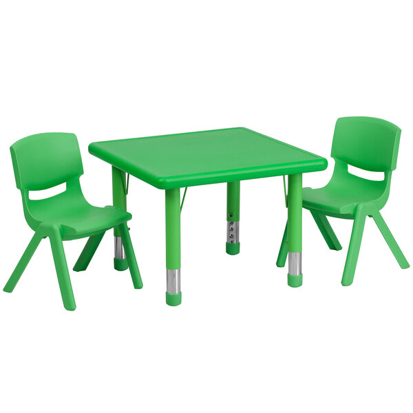 A green plastic table with legs and two green chairs.