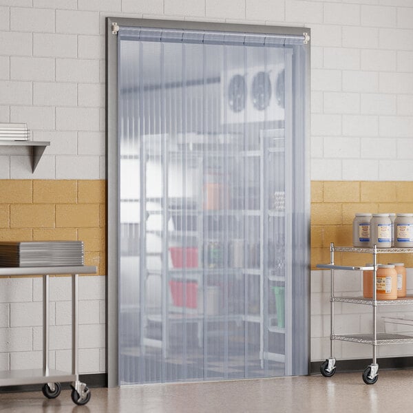 A room in a kitchen with a Curtron Polar Reinforced Strip Door.