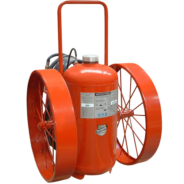 A red Buckeye fire extinguisher with steel wheels and rubber treads.