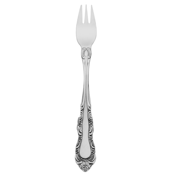 A Walco stainless steel cocktail fork with a pattern on the handle.