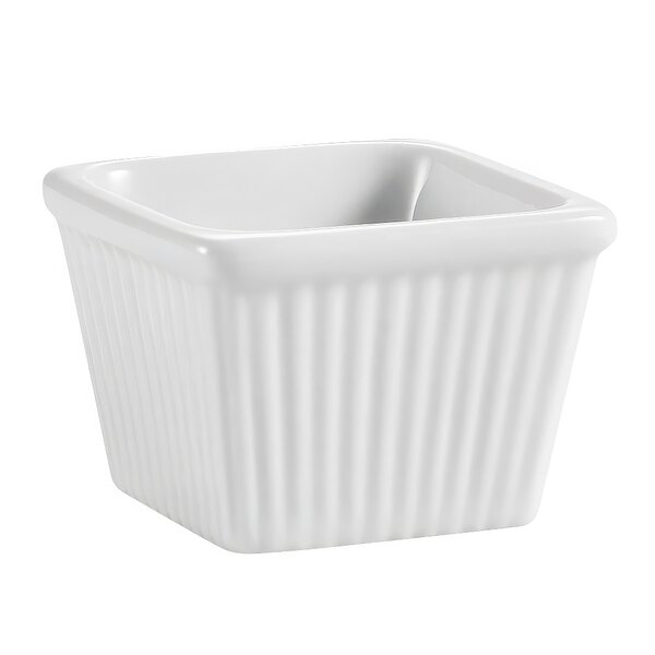 A white square China ramekin with fluted edges.