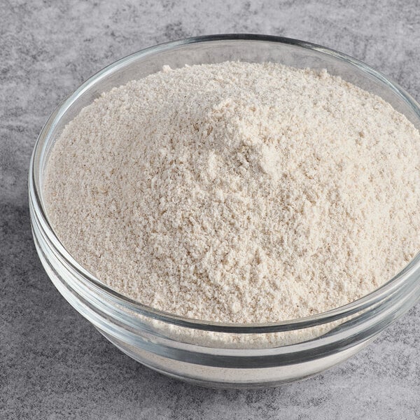 A glass bowl filled with fine, off-white gluten-free potato starch.