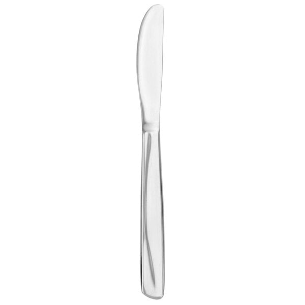 A silver Walco stainless steel butter knife with a scroll pattern on the handle.