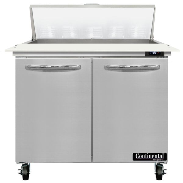 A stainless steel Continental Refrigerator with two doors and a cutting top.