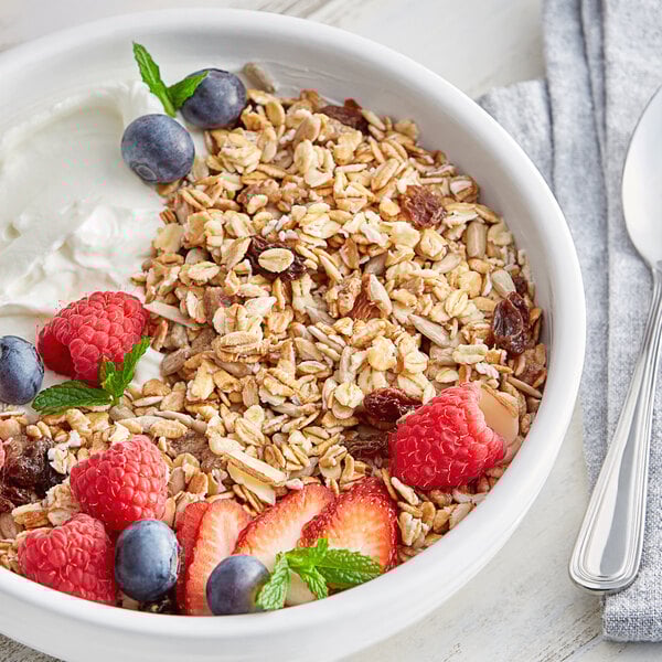 A bowl of Bob's Red Mill Old Country Style Muesli with fruit and yogurt.