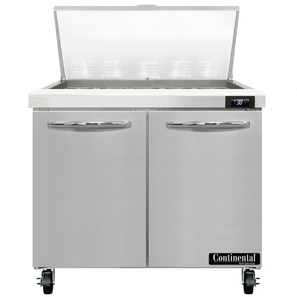 A white Continental Refrigerator with two doors open on a counter.