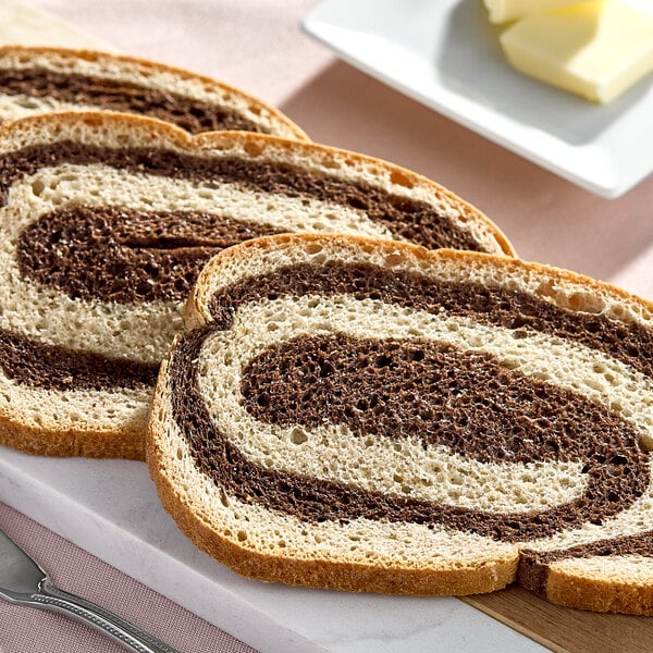 A few slices of marble rye bread with a swirl pattern of dark and light rye flour.