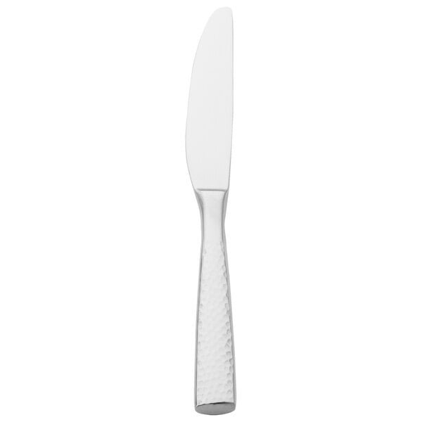 A silver Walco stainless steel dinner knife with a textured handle.