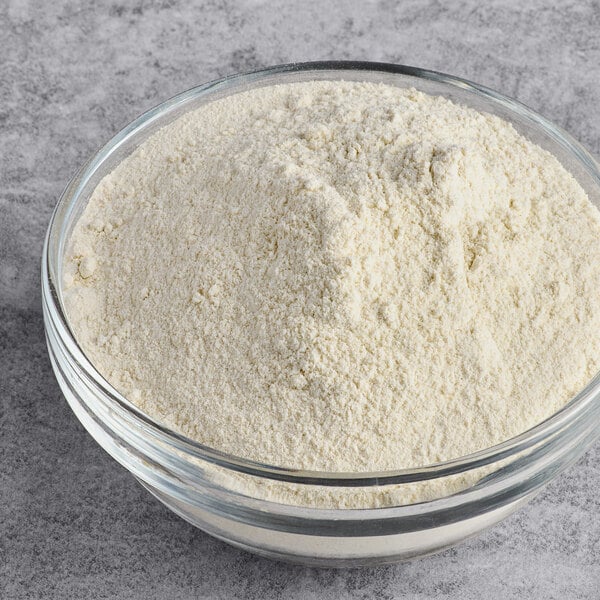A glass bowl filled with Bob's Red Mill organic quinoa flour.