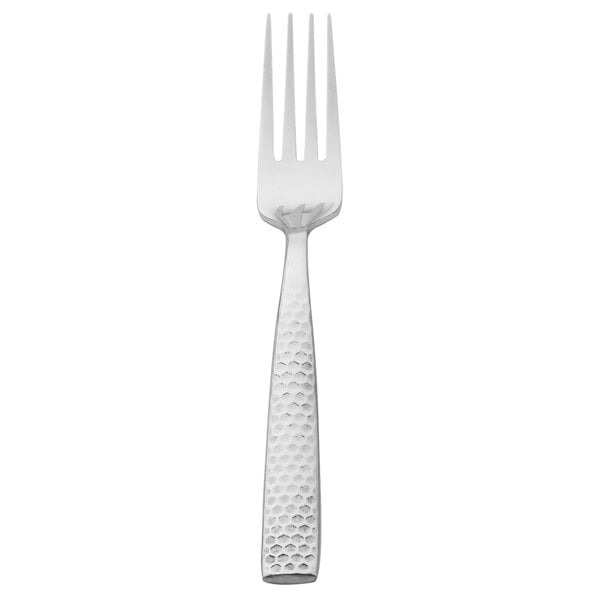 A Walco stainless steel dinner fork with a textured silver handle.