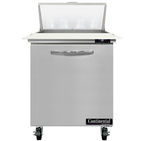 A stainless steel Continental Refrigerator with a door open.