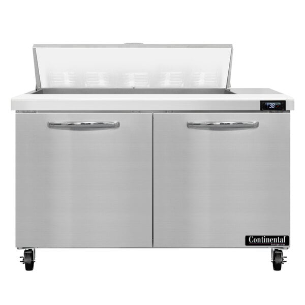 A stainless steel Continental Refrigerator with two doors and a lid.