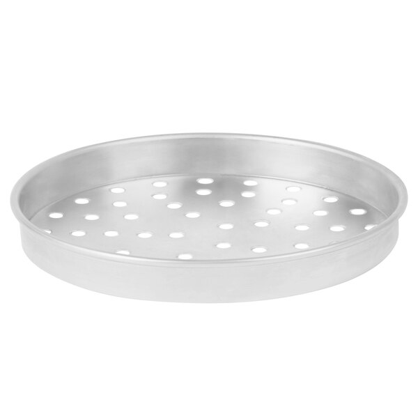 a round silver pan with holes