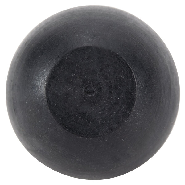A black round rubber foot with a circle in the middle.