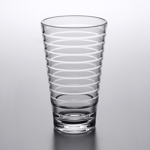A clear plastic mixing glass with a spiral pattern.