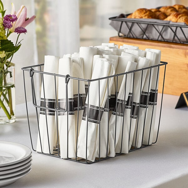 A rectangular metal gray wire basket filled with white plates.