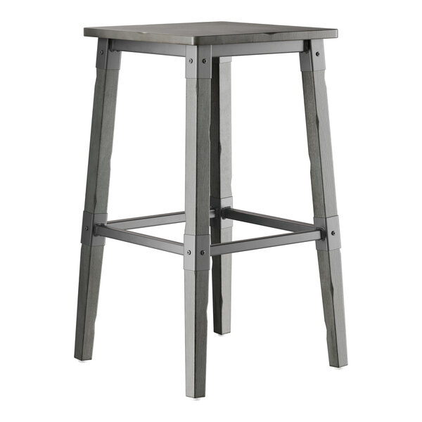 A Lancaster Table & Seating industrial bar stool with a slate gray seat and metal legs.