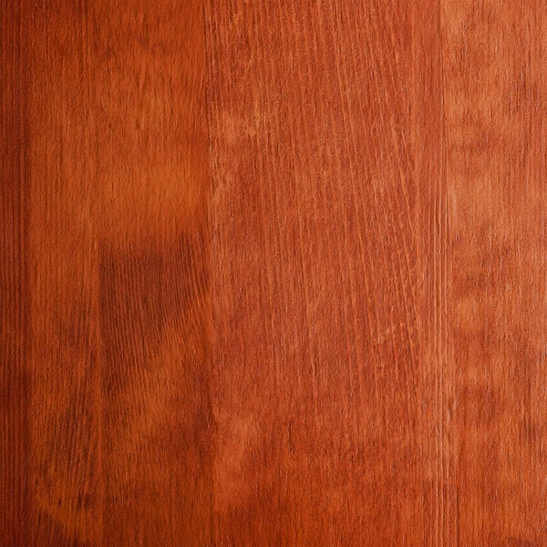 The seat of a Lancaster Table & Seating Industrial Chair with a Rustic Mahogany finish.